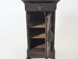 a small wooden cabinet with a door open on a white background
