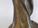 bronze statue of a woman with a veil on her head