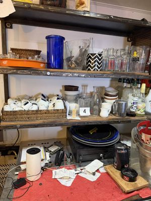 a table with many items on it in the kitchen