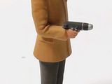 a figurine of a man standing on a plate