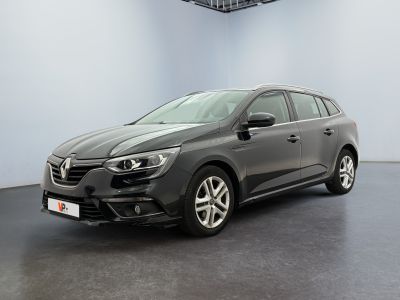 the grey car is parked in a large room with a black floor