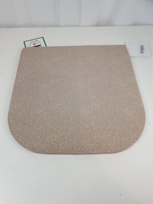a close up of a beige rug on a white table