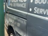 a van that is parked on the side of the street
