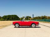 a red convertible car parked on the side of the road