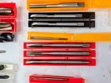 many different types of screws and screwdrivers in a box