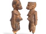 pair of carved wooden figures of a man and a woman