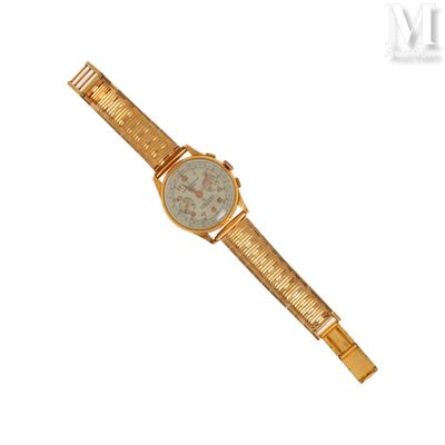 un gros plan d'une montre sur fond blanc, avec une règle