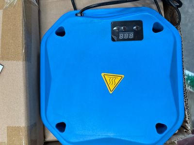 a blue box with a yellow triangle on it next to a box with a brown box and a brown box with a blue box with a yellow triangle on