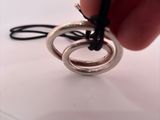 a person that is holding a ring in their hand
