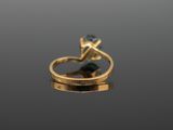 a close up of a gold ring with a blue topaz stone