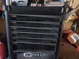 a black tool cart with a lot of tools on it