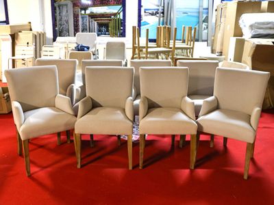 six chairs in the middle of a room with a red carpet