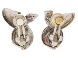 pair of silver and gold earrings with a bird on top
