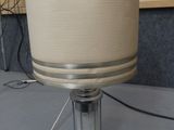 a lamp that is sitting on a table in a room