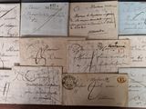many old envelopes on a wooden table