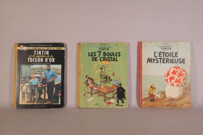 three books are lined up on a shelf next to each other