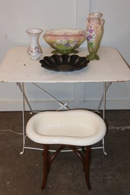 a small table with a bowl and a bowl on it