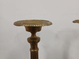 pair of antique brass candlesticks on marble bases
