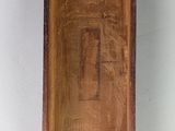 a wooden box with a clock inside of it