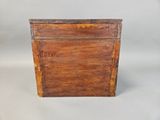 an old wooden box sitting on top of a white surface