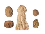 an image of a group of ancient artifacts on a white surface