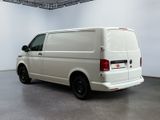 the white van is parked in the large room of the building