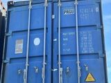 a blue container sitting on the back of a truck
