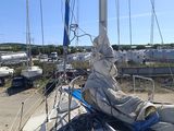 a sail boat that is docked in the water