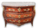 a marble top chest of drawers with a marble top