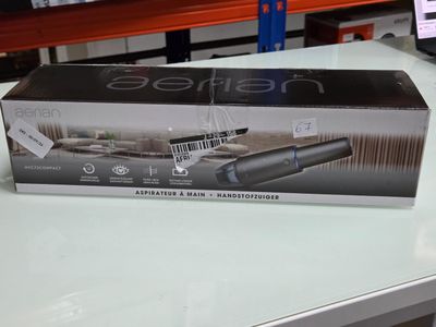 packaging of a hair dryer sitting on a table in a store