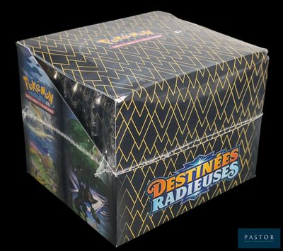 a close up of a box of pokemon trading cards on a black background