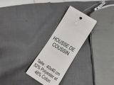 a close up of a label on a grey shirt