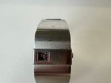 a watch that is sitting on a white surface