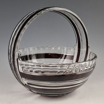 a glass bowl with a handle on a table