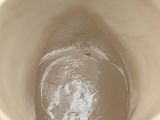 a close up view of a cup with water in it