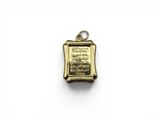 a gold plated pendant with a picture of a man in a boat
