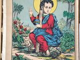 an old book with a picture of jesus sitting on a cross