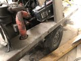 a small engine that is sitting in the back of a truck
