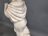 marble statue of a boy with a scarf on his head