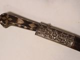 a knife that is laying on a table