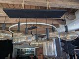 a chandelier that has a lot of lights hanging from it