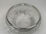 a glass bowl with a lid on a white table
