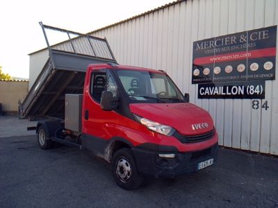 a red truck that is parked in front of a building