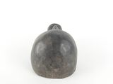 a black object on a white surface with a white background
