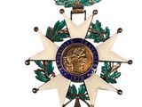 an image of a medal with a star and a wreath around it