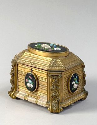 a gold box with a black and white picture on it