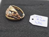 a ring that is sitting on top of a black cloth