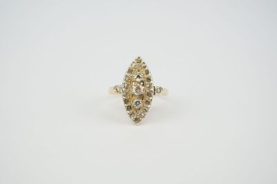 a yellow and white diamond ring on a white surface