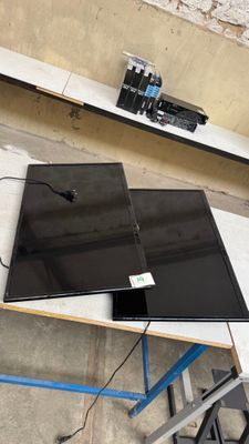 a laptop computer sitting on top of a table in a room