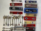 many different types of spoons and spoon knives on the table